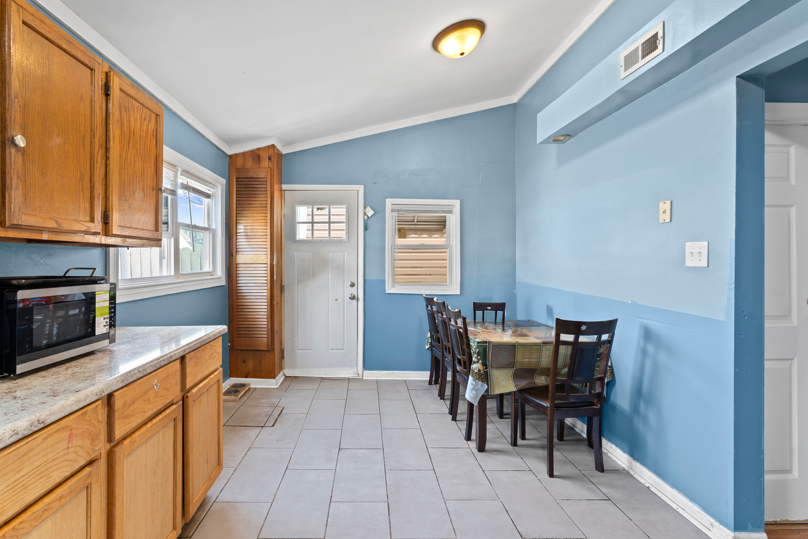 2103 North Long Avenue Chicago, IL 60639 - Photo 8 of 21 a view of a dining room with furniture and chandelier