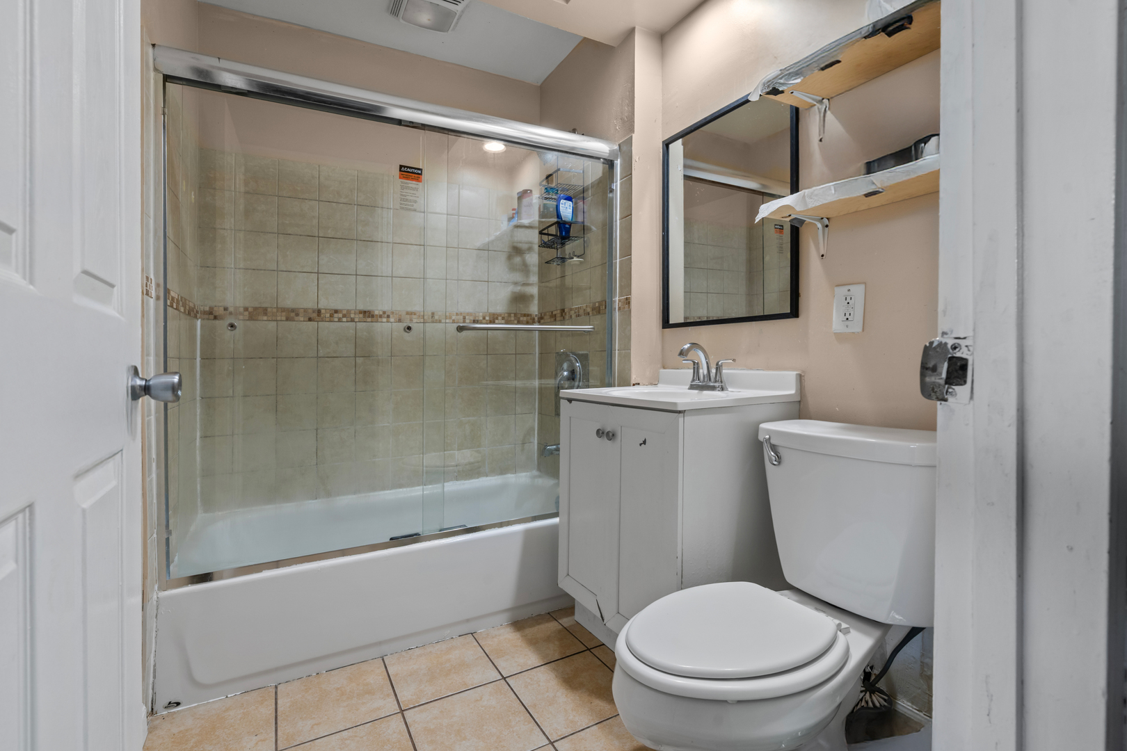 2103 North Long Avenue Chicago, IL 60639 - Photo 9 of 21 a bathroom with a sink toilet and shower