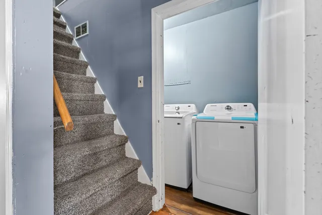 a view of entryway with hallway and stairs