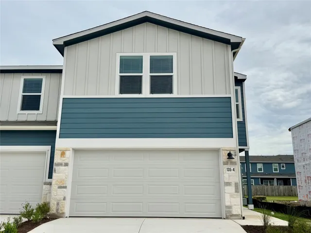 a front view of a house with glass windows