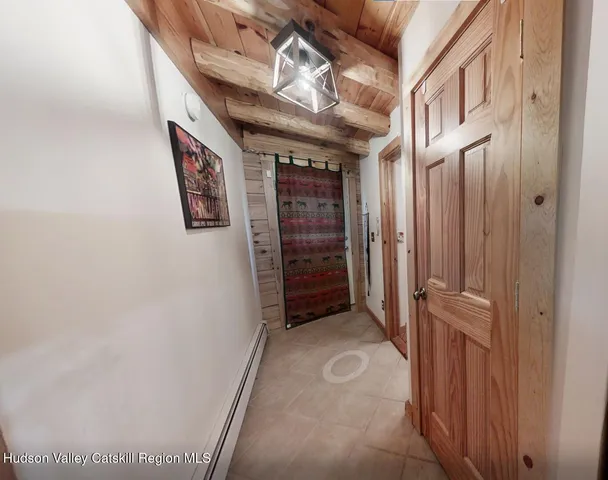 a view of a bedroom with washer and dryer