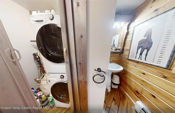 a living room with lots of furniture and a chandelier