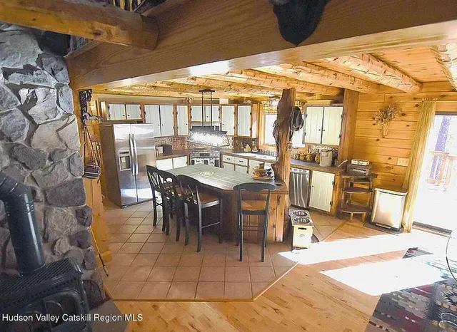 a kitchen with a dining table and chairs