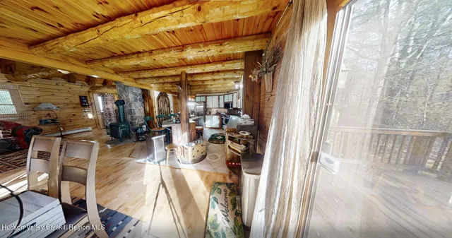 a view of a dining room with furniture window and outside view