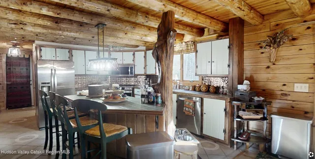 a view of a livingroom with wooden floor and flat screen tv