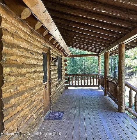 a view of outdoor space with wooden floor and iron stairs
