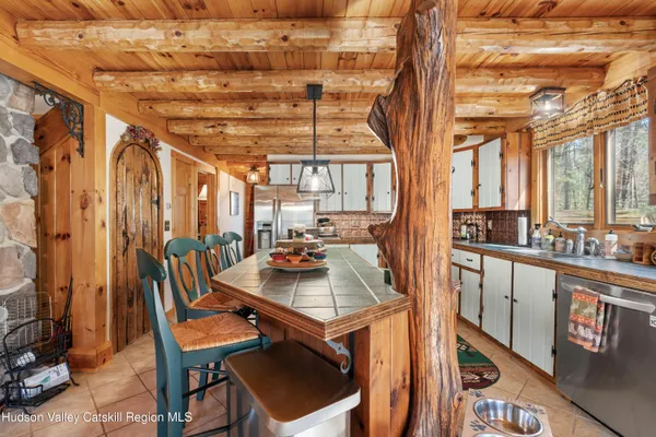 a kitchen with stainless steel appliances granite countertop a stove and a sink