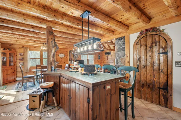 a view of a livingroom with wooden floor and furniture