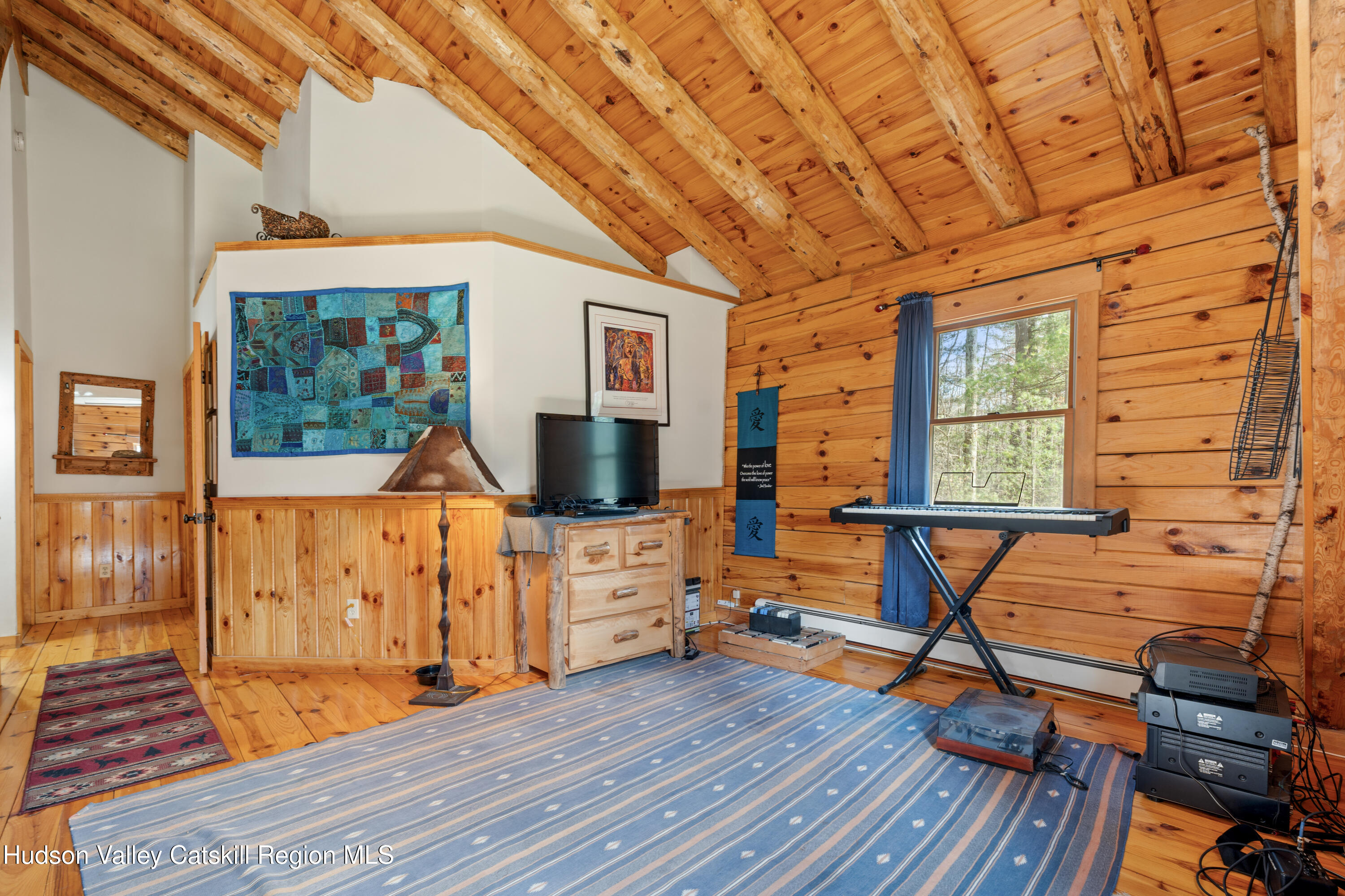 1311 Wittenberg Road Mount Tremper, NY 12457 - Photo 52 of 52 a view of a livingroom with wooden floor and furniture