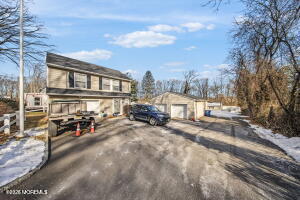 Magnolia Lane Middletown, NJ 07748 - Photo 1 of 4 a view of a house with cars park
