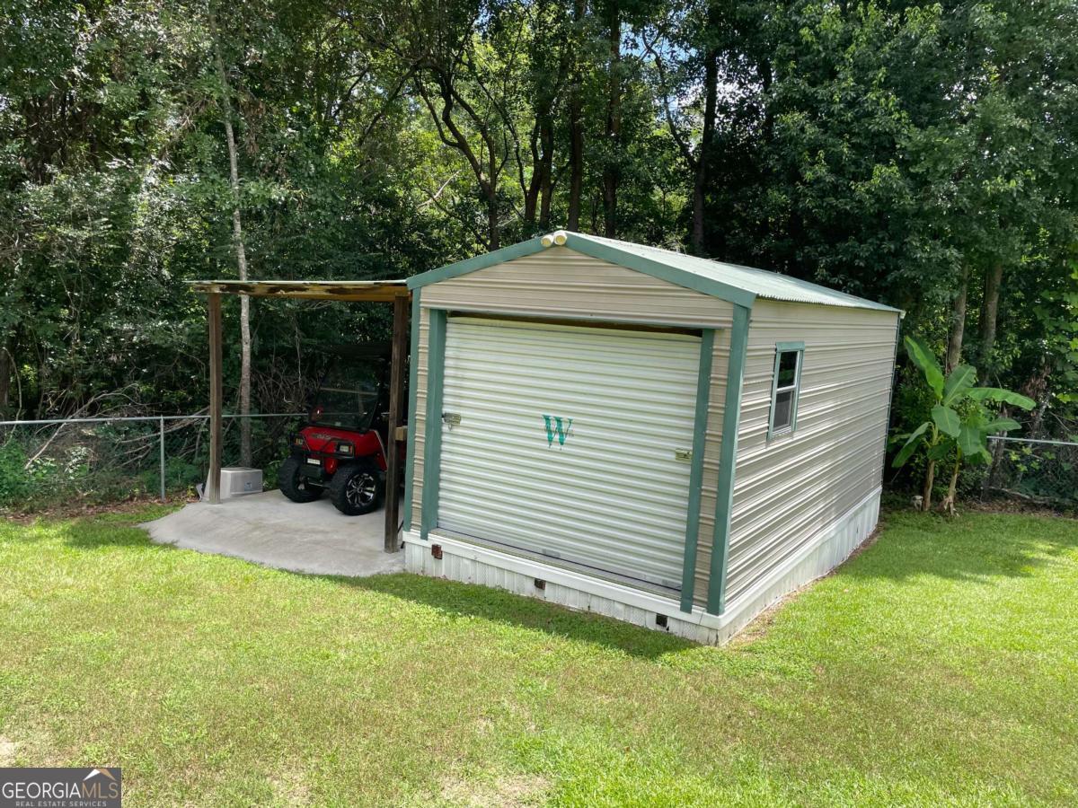 601 Auburn Road Glennville, GA 30427 - Photo 17 of 17 a view of a house with a yard
