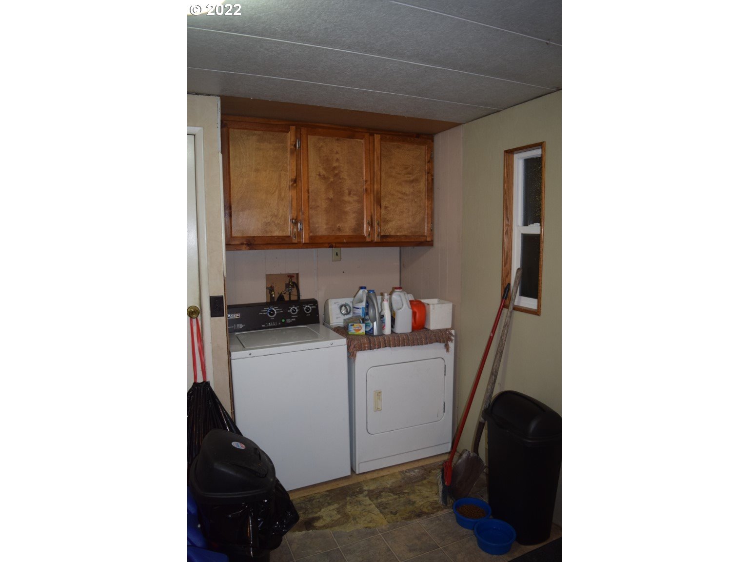 2414 North Ott Road Hermiston, OR 97838 - Photo 16 of 23 a kitchen with a sink and a refrigerator