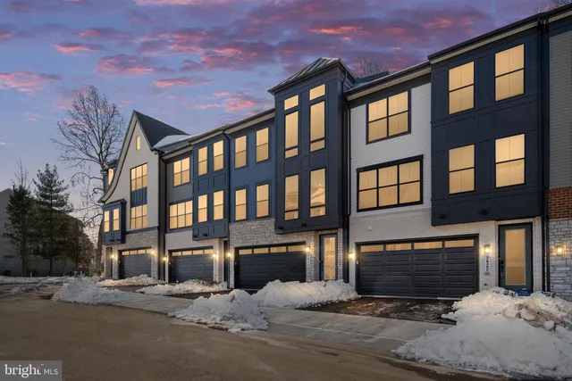 a kitchen with stainless steel appliances granite countertop a sink a stove a refrigerator and island with wooden floor