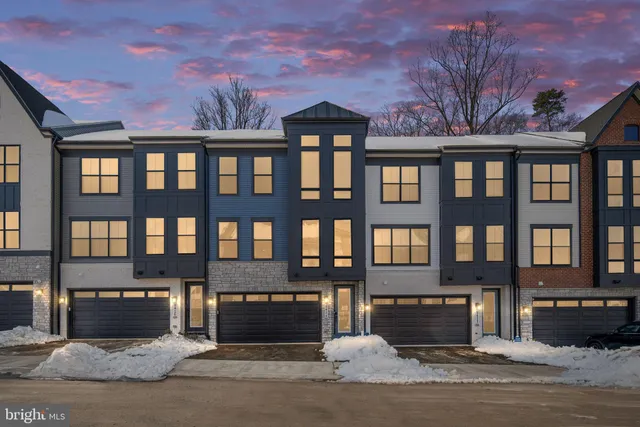 a kitchen with a sink a counter top space cabinets and stainless steel appliances