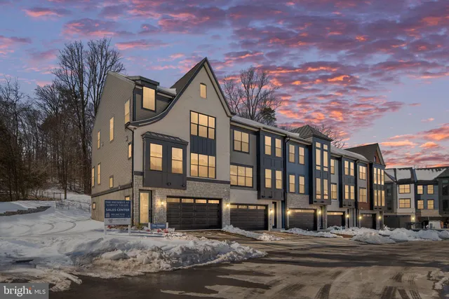 a bathroom with a shower a toilet and a sink