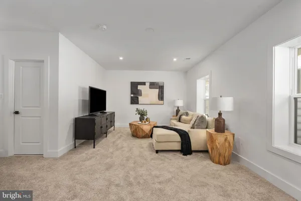 a living room with furniture and flowers