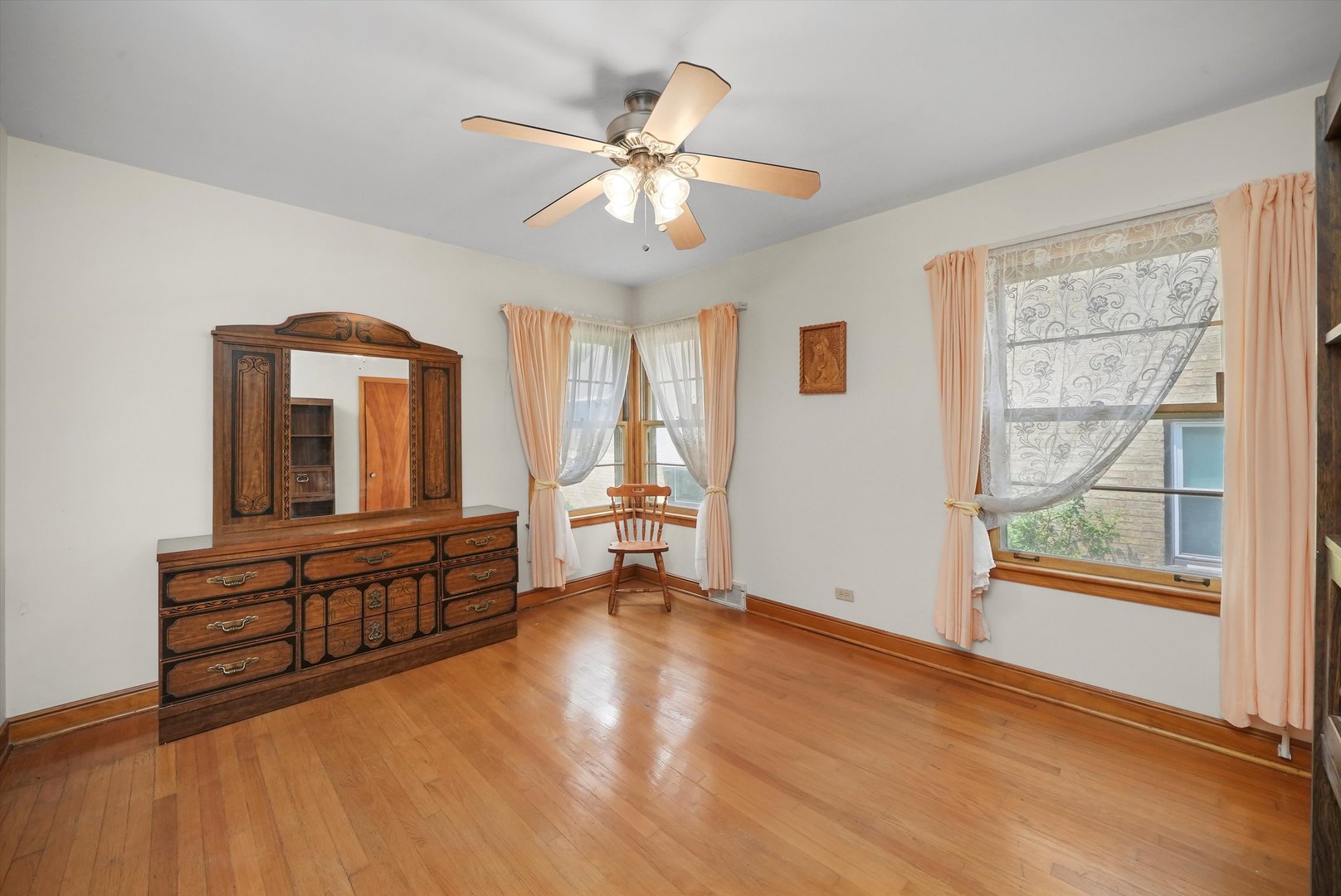 560 Selborne Road Riverside, IL 60546 - Photo 15 of 32 wooden floor in an empty room with a window