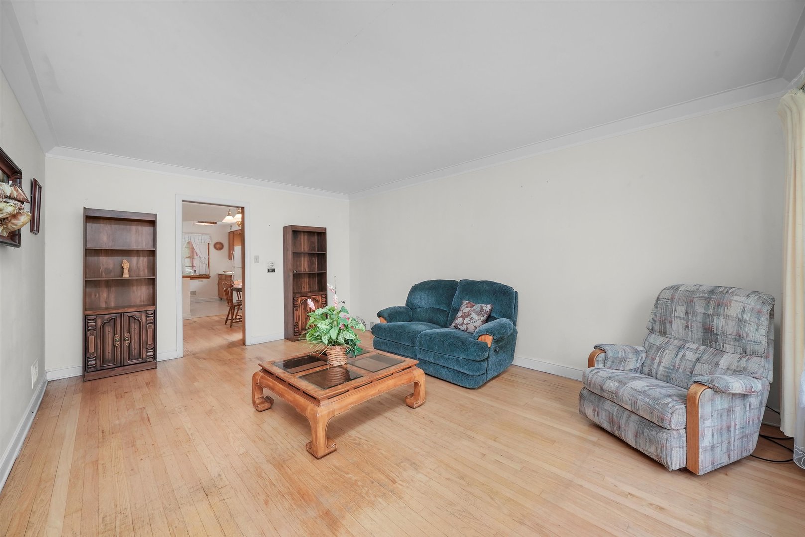 560 Selborne Road Riverside, IL 60546 - Photo 2 of 32 a living room with furniture and a wooden floor