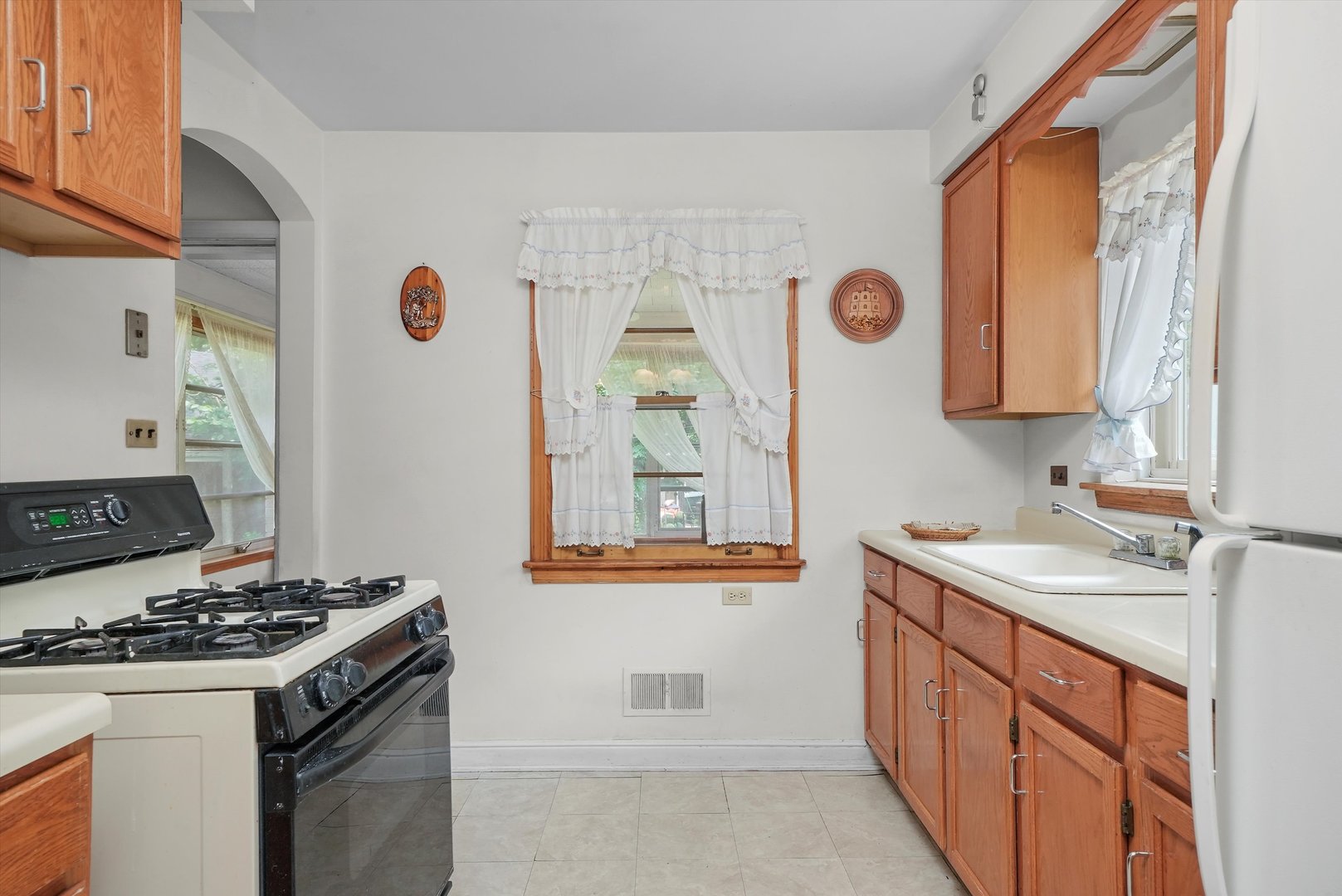 560 Selborne Road Riverside, IL 60546 - Photo 7 of 32 a kitchen with stainless steel appliances granite countertop a stove and a sink