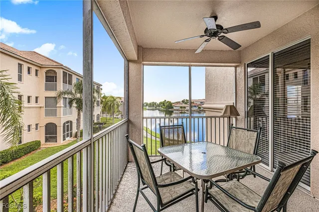 a view of a balcony with furniture and wooden floor