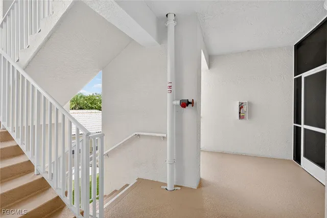 an aerial view of residential houses with outdoor space and river
