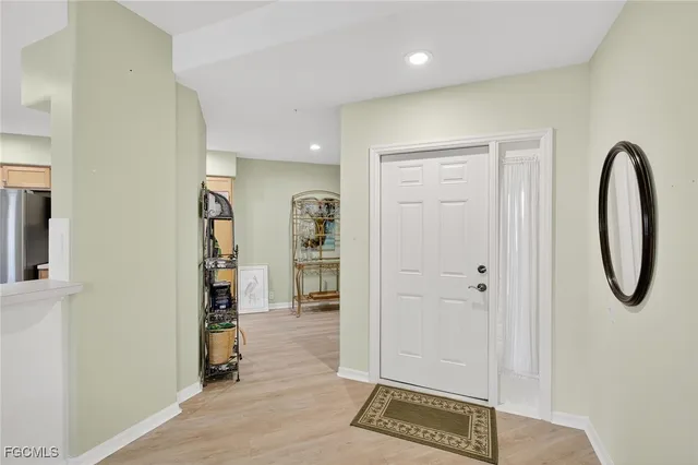 a view of an entryway with wooden floor