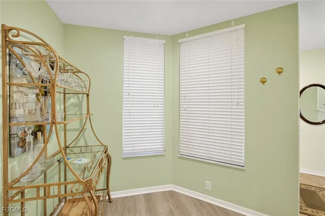 a bathroom with a window and white walls