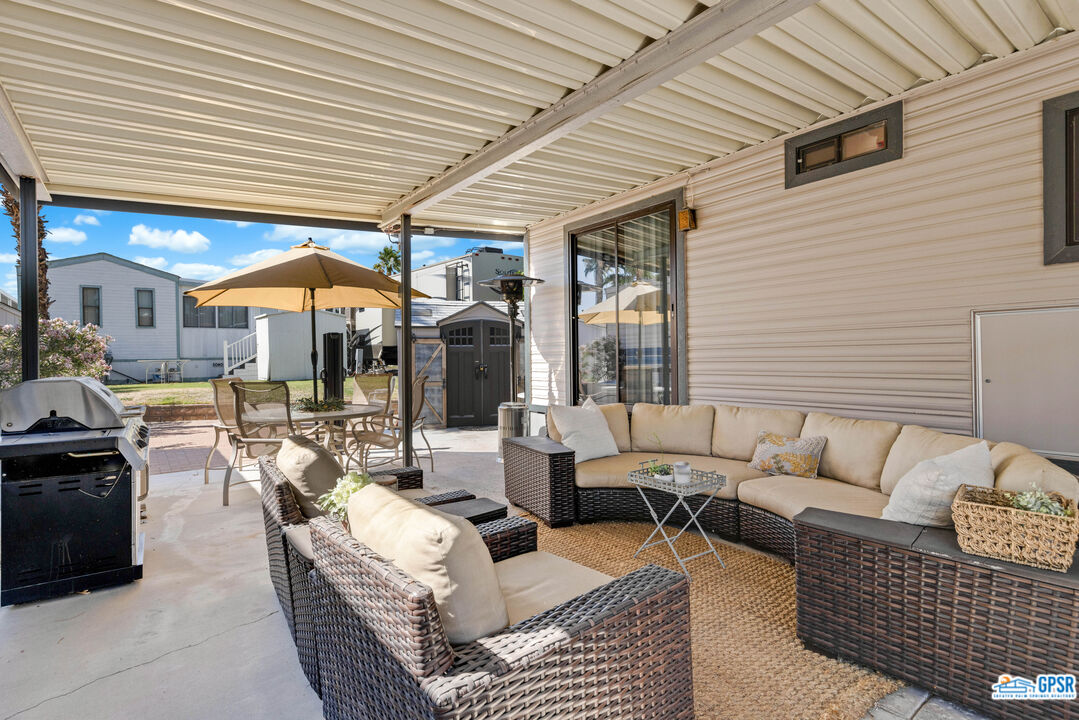 69801 Ramon Road, Unit 28 Cathedral City, CA 92234 - Photo 4 of 20 a outdoor living space with patio furniture and a potted plant