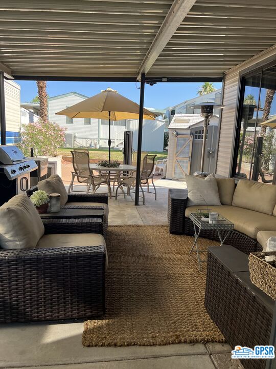 69801 Ramon Road, Unit 28 Cathedral City, CA 92234 - Photo 5 of 20 a outdoor space with patio lots of furniture and outdoor seating