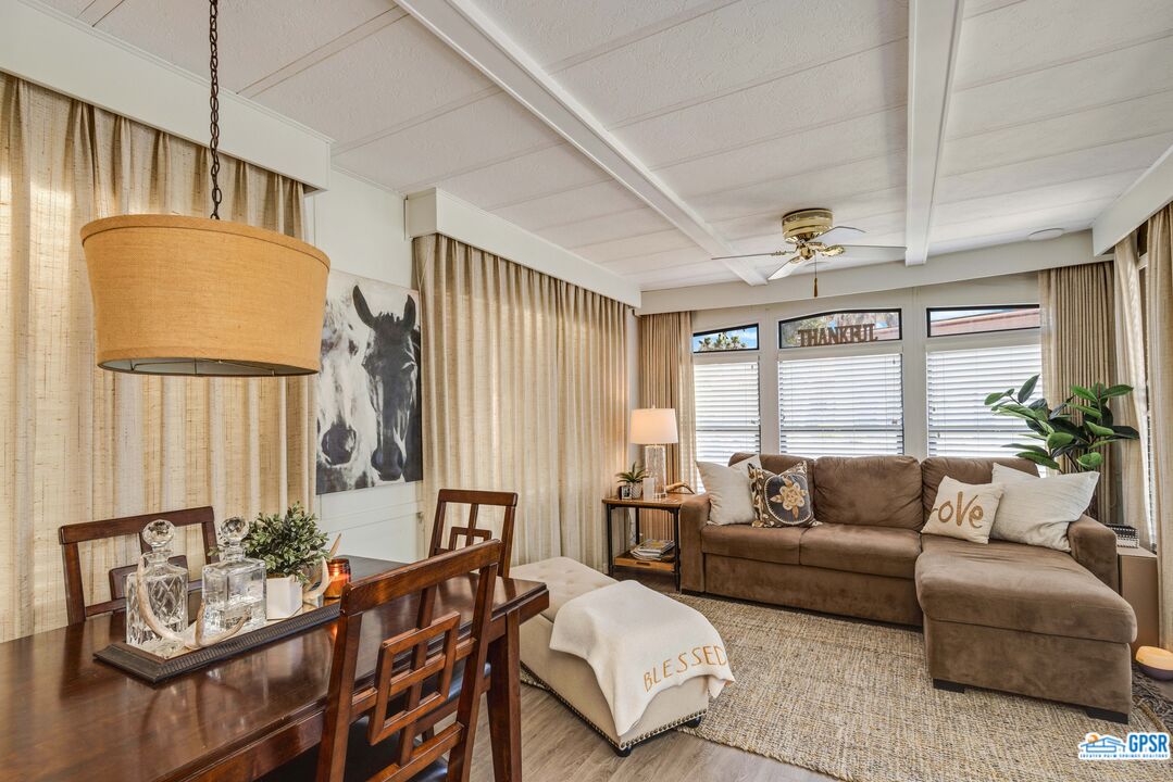 69801 Ramon Road, Unit 28 Cathedral City, CA 92234 - Photo 8 of 20 a living room with furniture and a large window