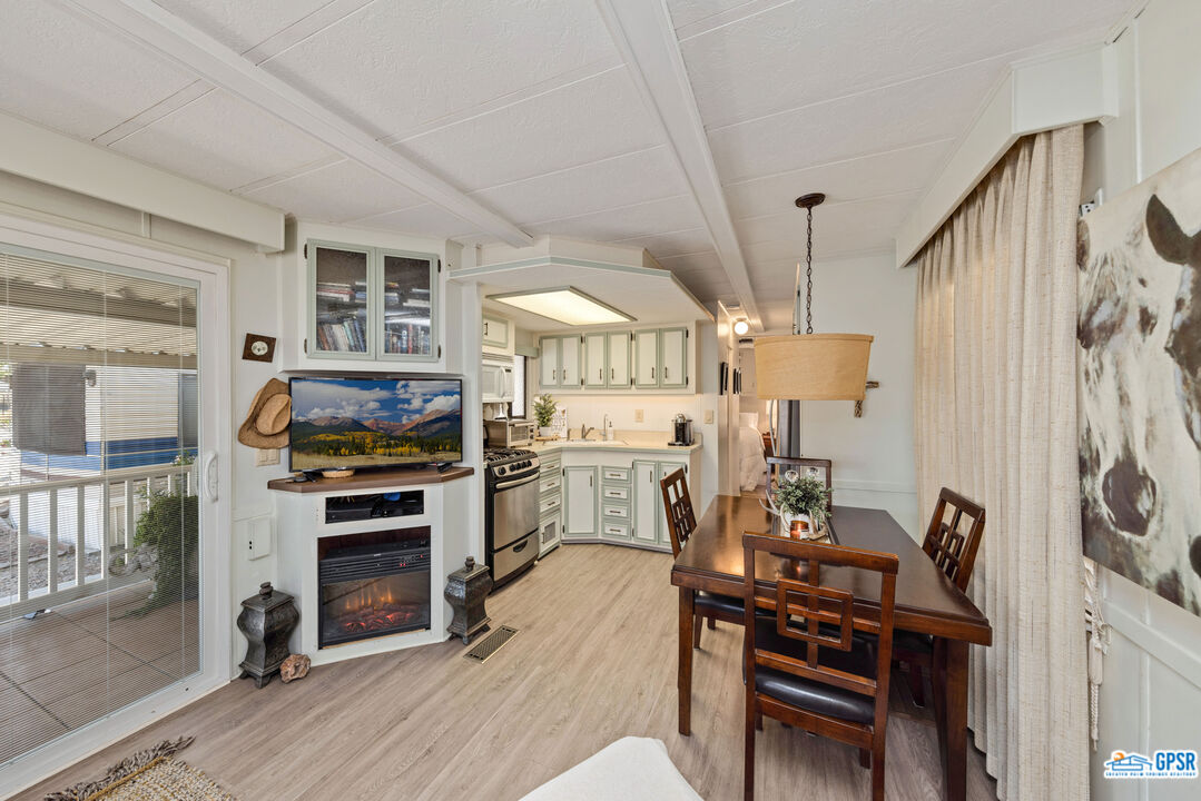 69801 Ramon Road, Unit 28 Cathedral City, CA 92234 - Photo 9 of 20 a view of a room with furniture and wooden floor