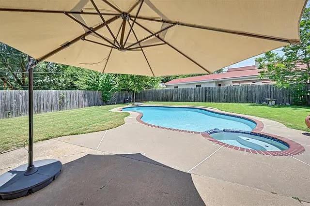 1401 Apache Street Arlington, TX 76012 - Photo 15 of 17 a view of a backyard with a swimming pool