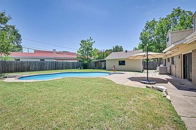 1401 Apache Street Arlington, TX 76012 - Photo 16 of 17 a swimming pool with outdoor seating and yard