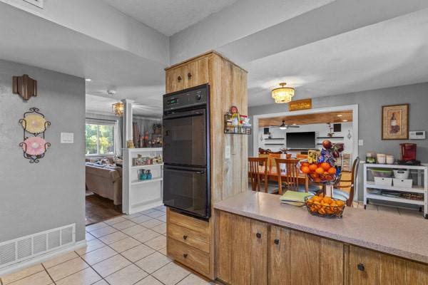 1401 Apache Street Arlington, TX 76012 - Photo 6 of 17 a kitchen with refrigerator and cabinets