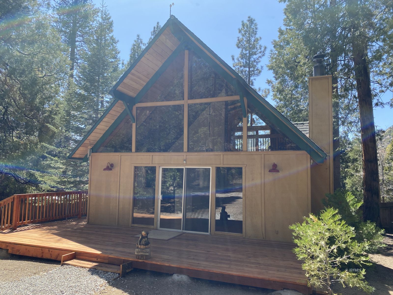 25155 Fern Valley Road Idyllwild, CA 92549 - Photo 1 of 2 a front view of a house with a garden and plants