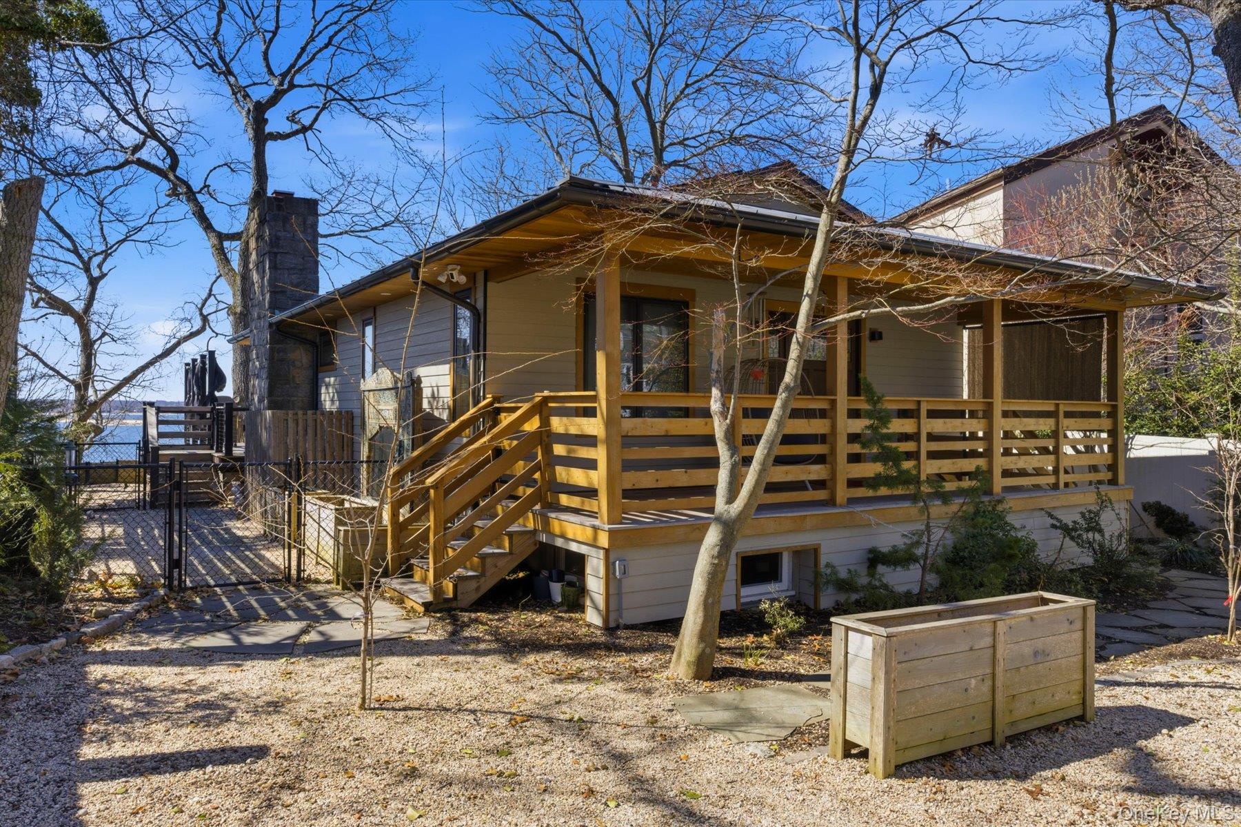 154 Eatons Neck Road Northport, NY 11768 - Photo 1 of 39 a front view of a house with garden