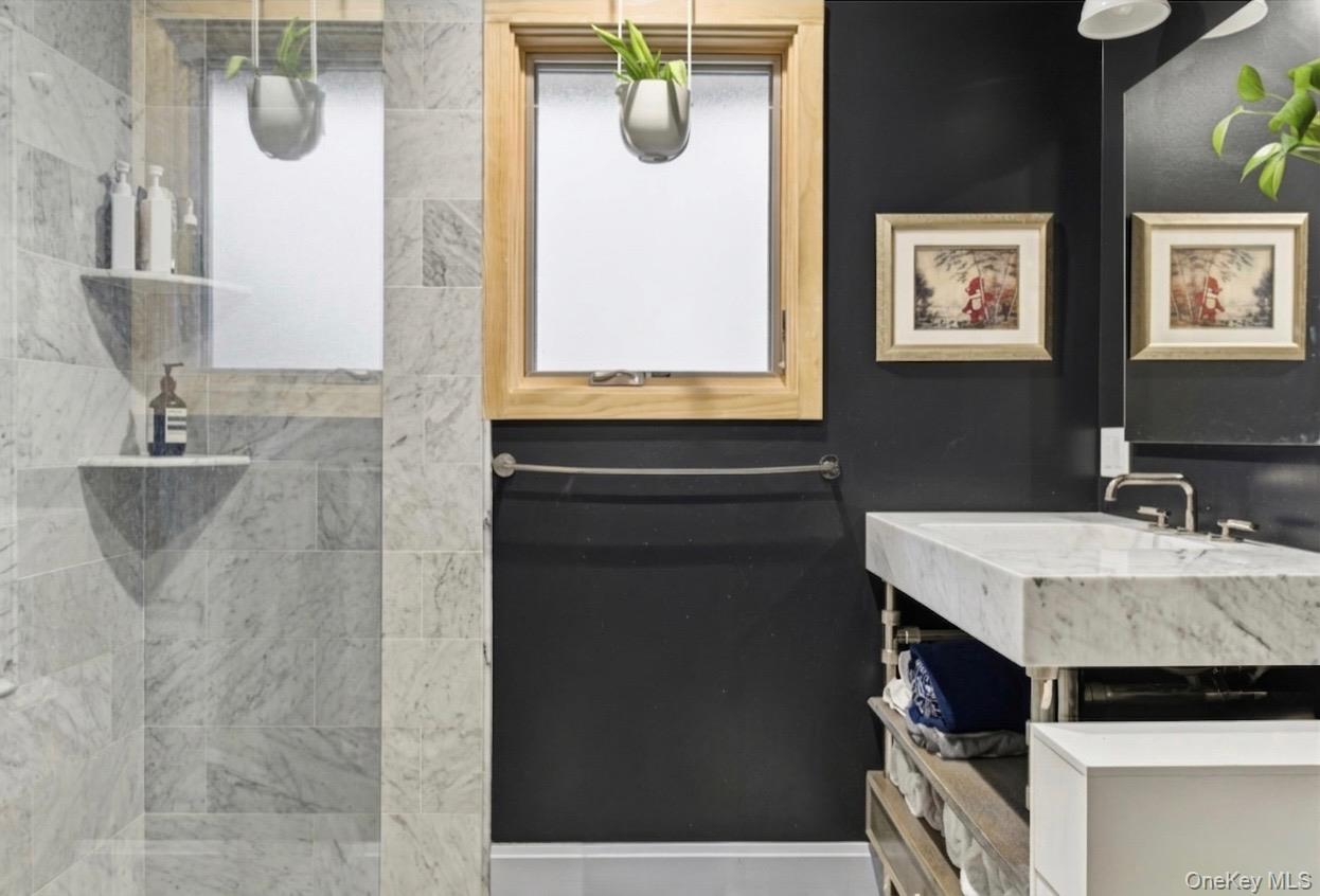 154 Eatons Neck Road Northport, NY 11768 - Photo 11 of 39 a bathroom with a sink vanity and mirror