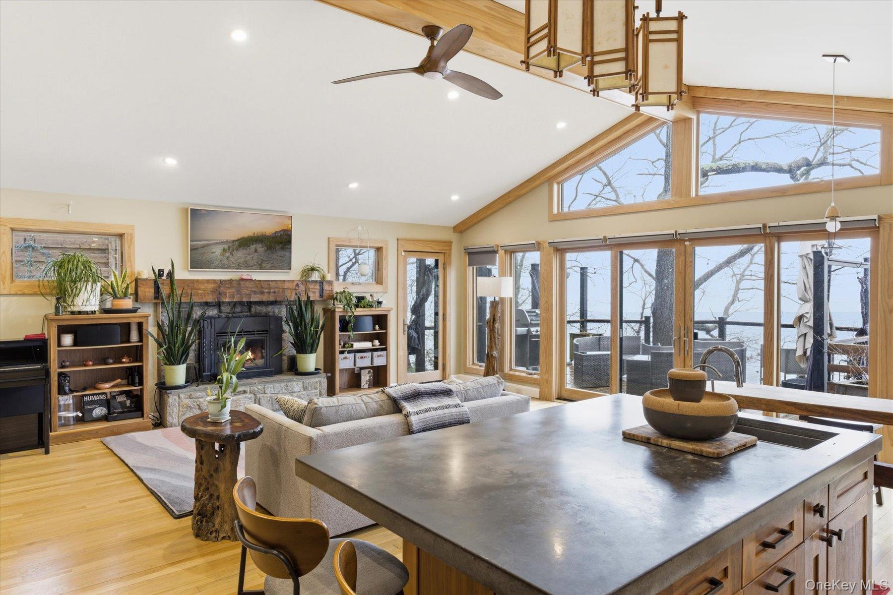 154 Eatons Neck Road Northport, NY 11768 - Photo 17 of 39 a kitchen with a table chairs and wooden floor