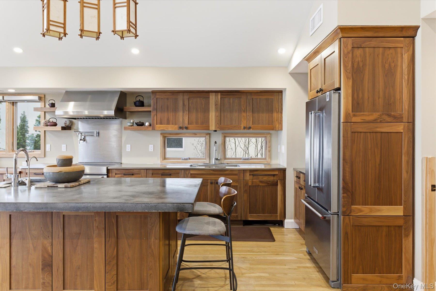 154 Eatons Neck Road Northport, NY 11768 - Photo 21 of 39 a kitchen with stainless steel appliances granite countertop a refrigerator and a sink