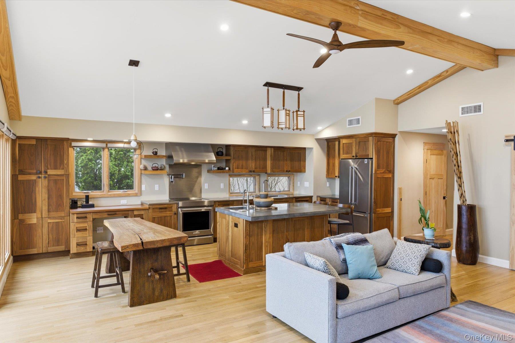 154 Eatons Neck Road Northport, NY 11768 - Photo 23 of 39 a living room with stainless steel appliances kitchen island granite countertop furniture and a kitchen view