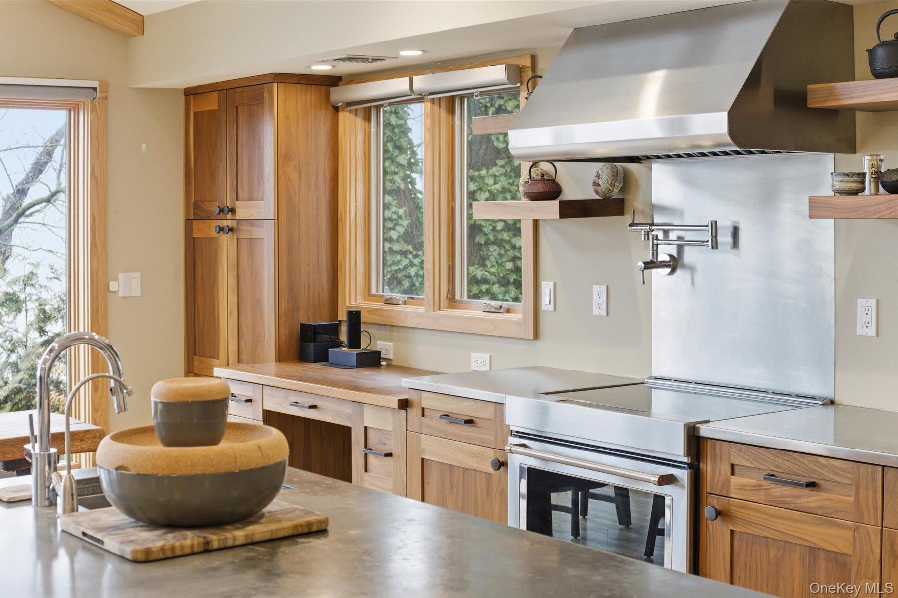154 Eatons Neck Road Northport, NY 11768 - Photo 26 of 39 a kitchen with stainless steel appliances granite countertop a sink and a refrigerator