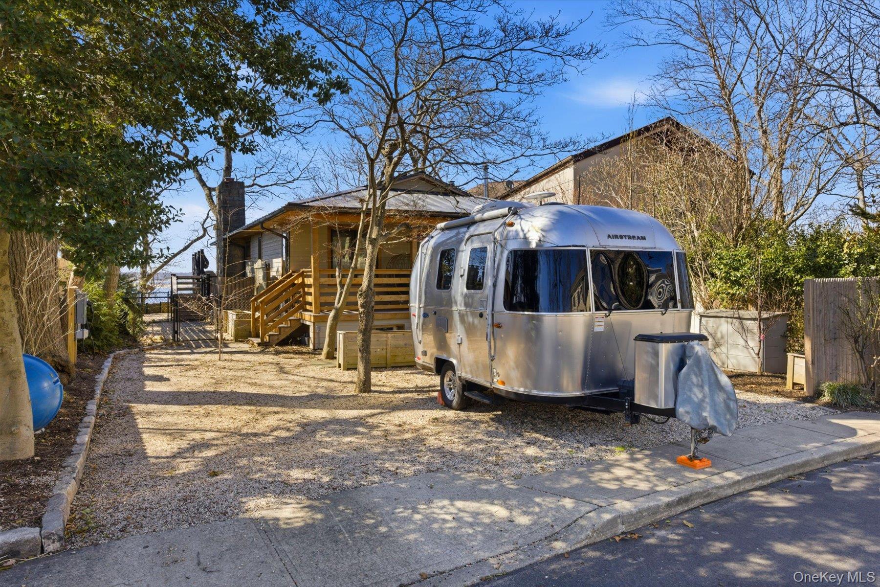 154 Eatons Neck Road Northport, NY 11768 - Photo 3 of 39 a view of a house with a yard