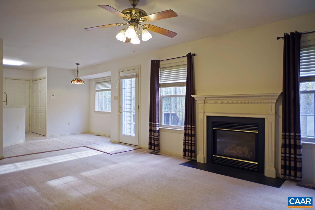 158 Northridge Road Ruckersville, VA 22968 - Photo 13 of 50 a view of an empty room with chandelier fan and fire place