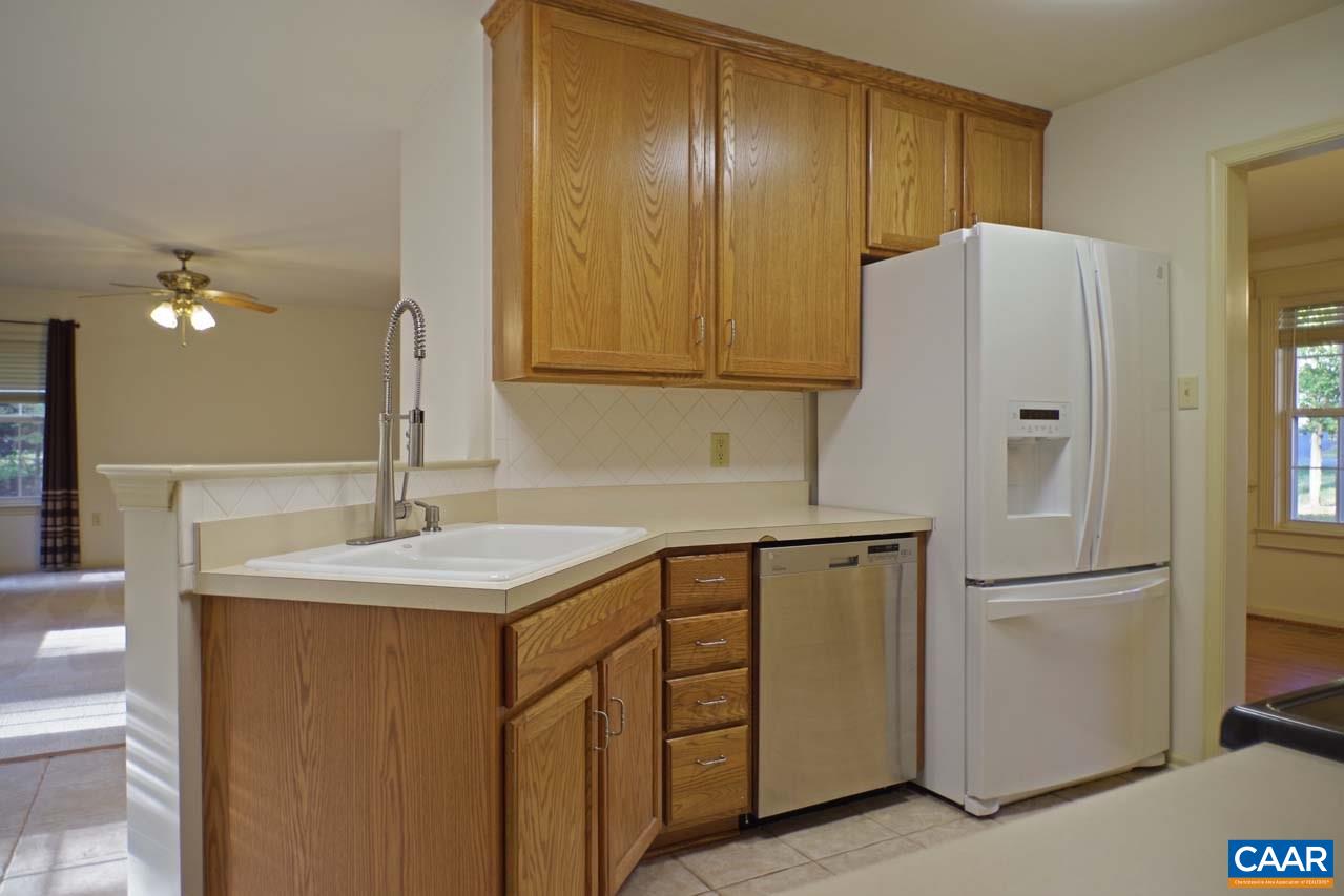 158 Northridge Road Ruckersville, VA 22968 - Photo 18 of 50 a kitchen with a refrigerator sink and cabinets