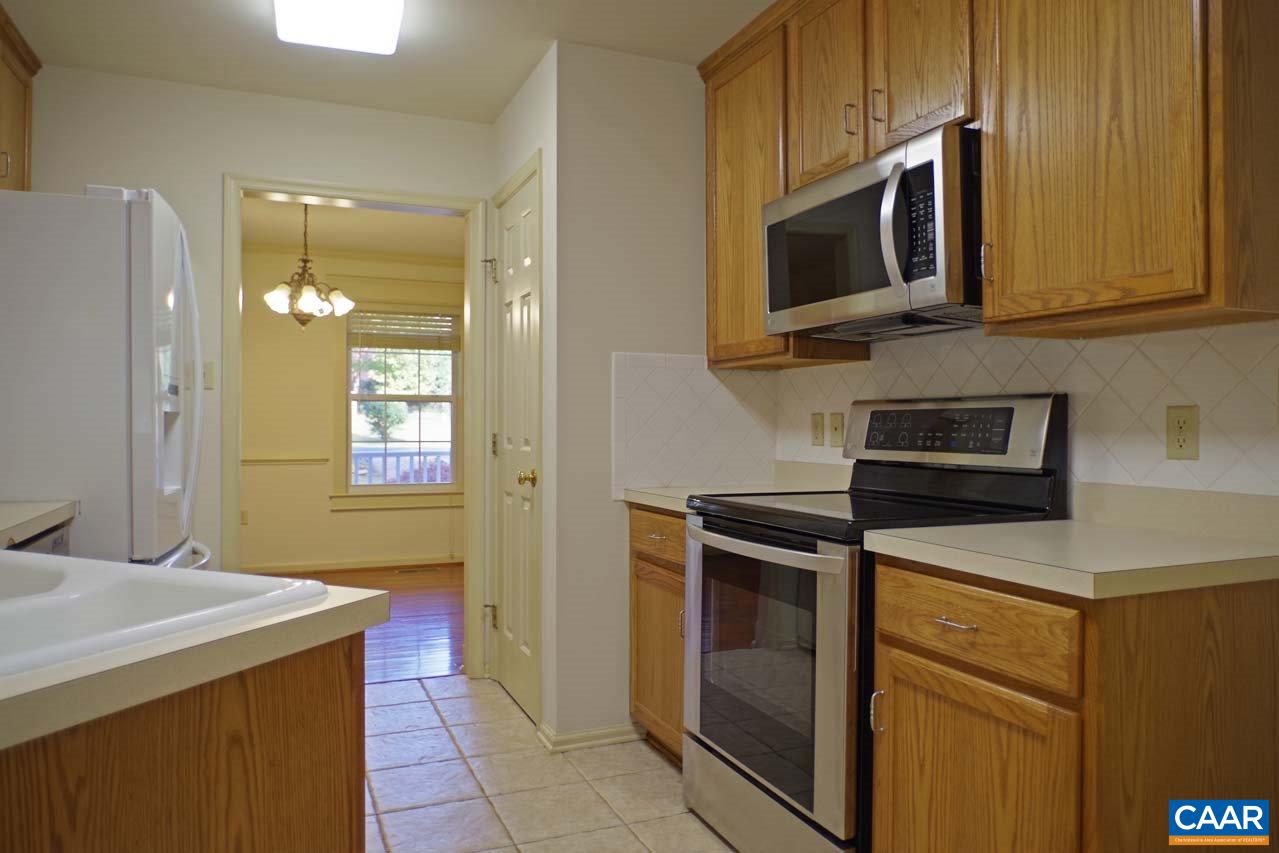 158 Northridge Road Ruckersville, VA 22968 - Photo 19 of 50 a kitchen with stainless steel appliances granite countertop a stove microwave and refrigerator