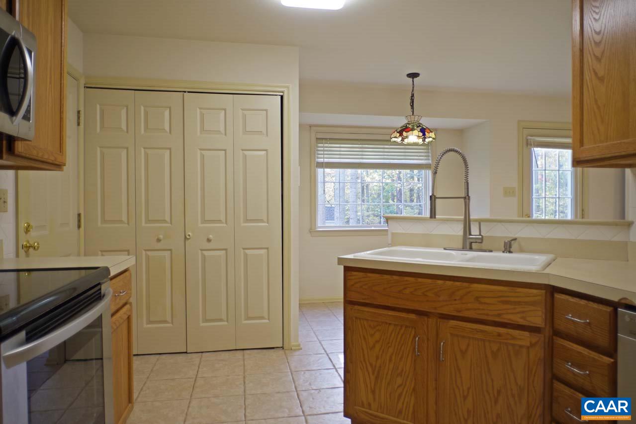 158 Northridge Road Ruckersville, VA 22968 - Photo 21 of 50 a kitchen with a sink stove and cabinets