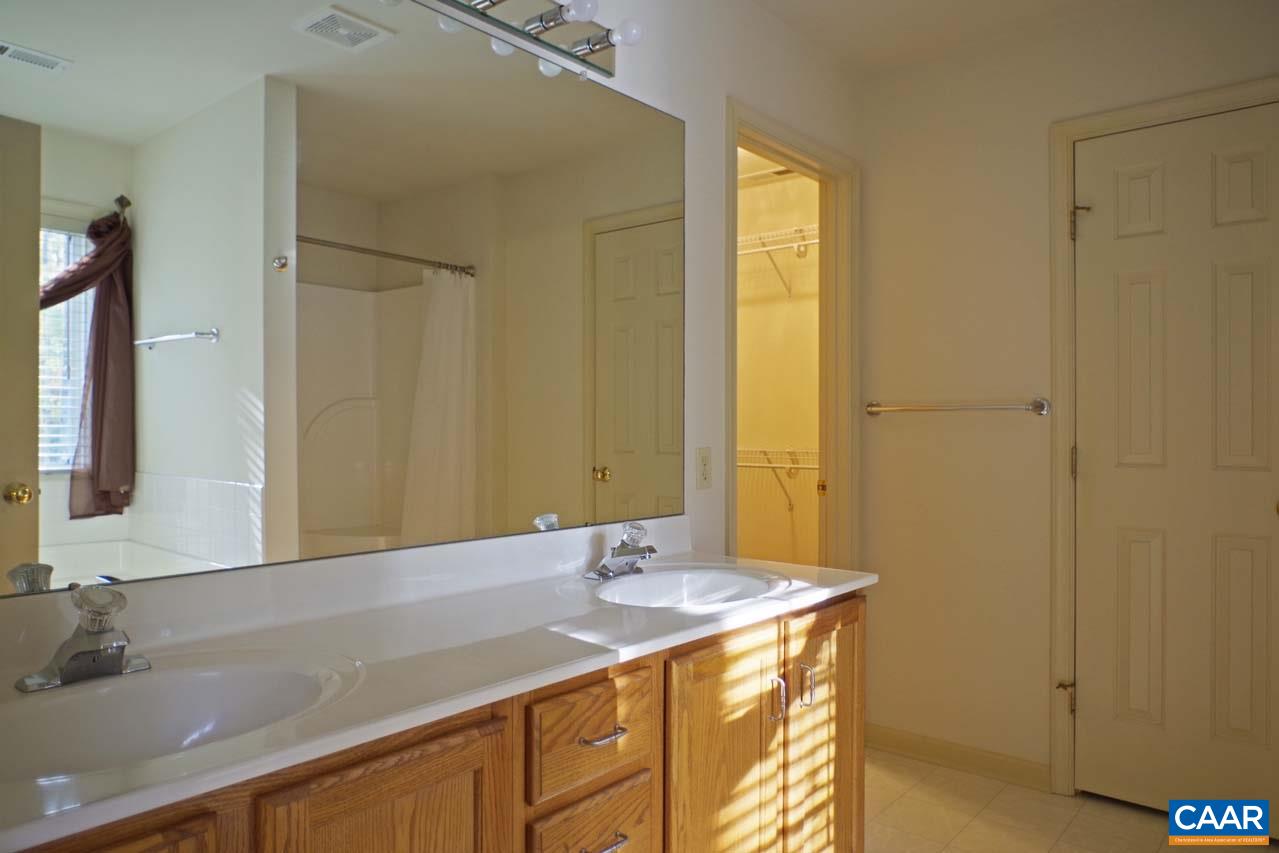 158 Northridge Road Ruckersville, VA 22968 - Photo 33 of 50 a bathroom with a granite countertop sink and a mirror