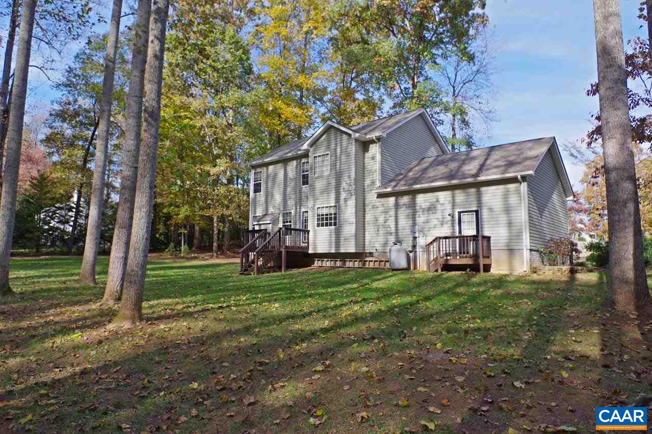 158 Northridge Road Ruckersville, VA 22968 - Photo 44 of 50 a view of a house with a big yard and large trees