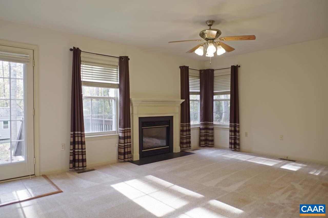 158 Northridge Road Ruckersville, VA 22968 - Photo 9 of 50 a view of an empty room with a fireplace and a window