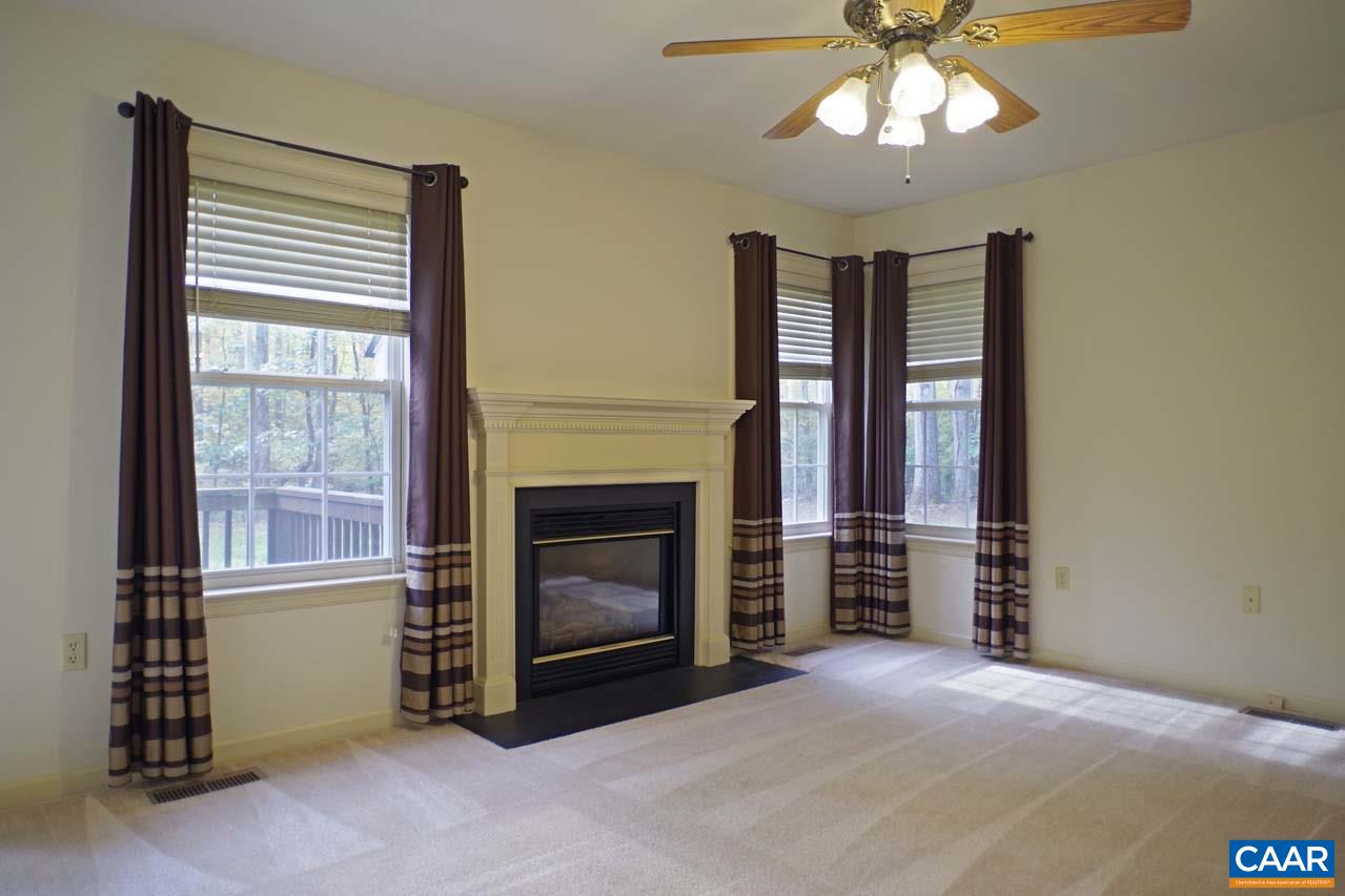 158 Northridge Road Ruckersville, VA 22968 - Photo 10 of 50 a view of an empty room with a fireplace and a window
